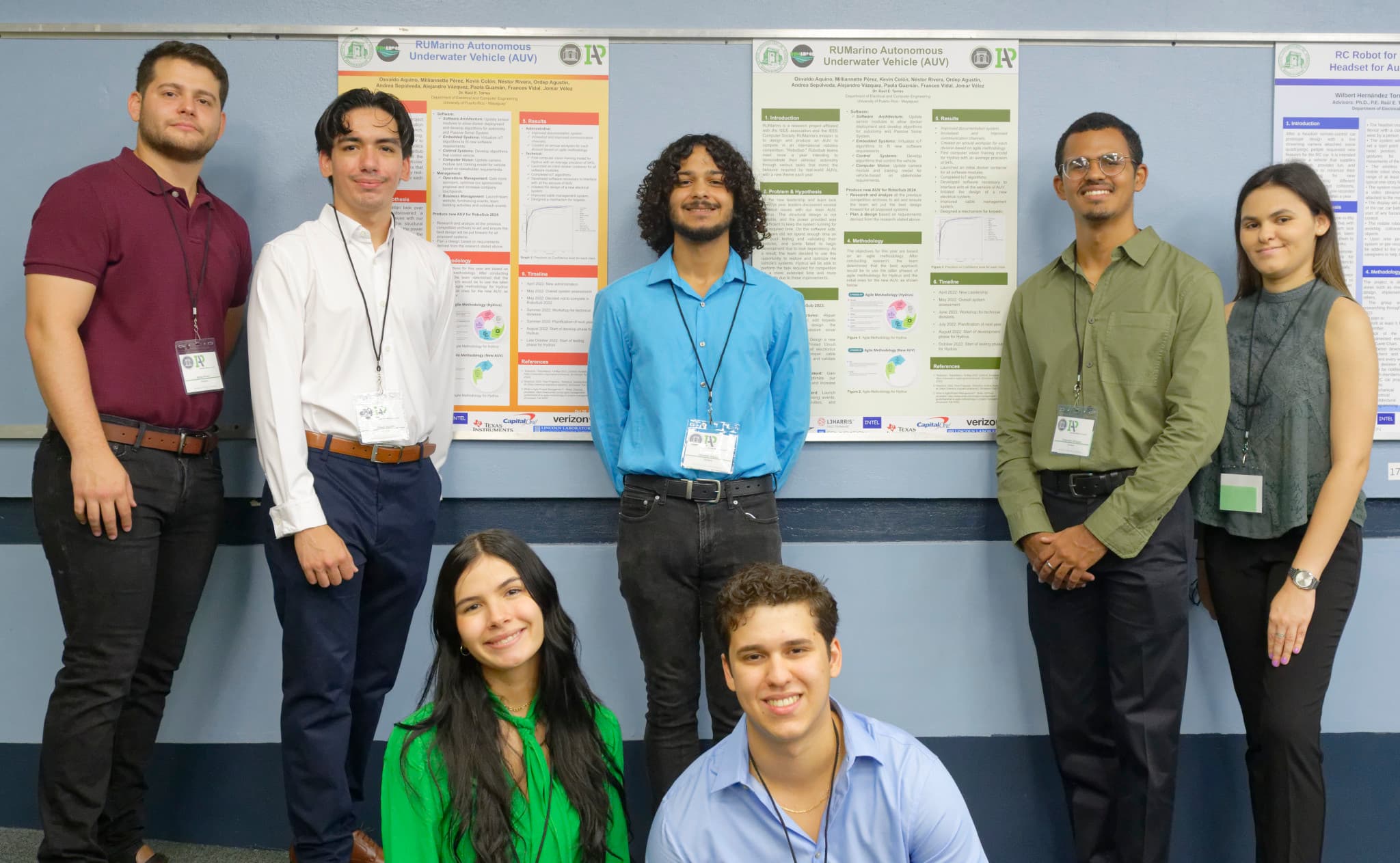 Students demonstrating a capstone project to industry partners